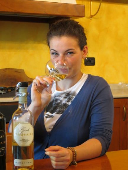 Sara, the hospitality manager, tasting a glass of Soave.